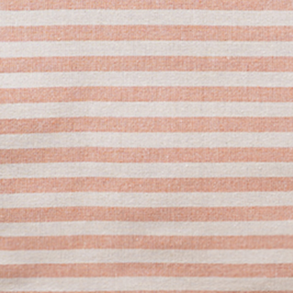 Close-up fabric swatch of an orange and white striped cotton tablecloth showing the woven textile texture.