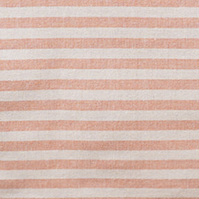 Close-up fabric swatch of an orange and white striped cotton tablecloth showing the woven textile texture.