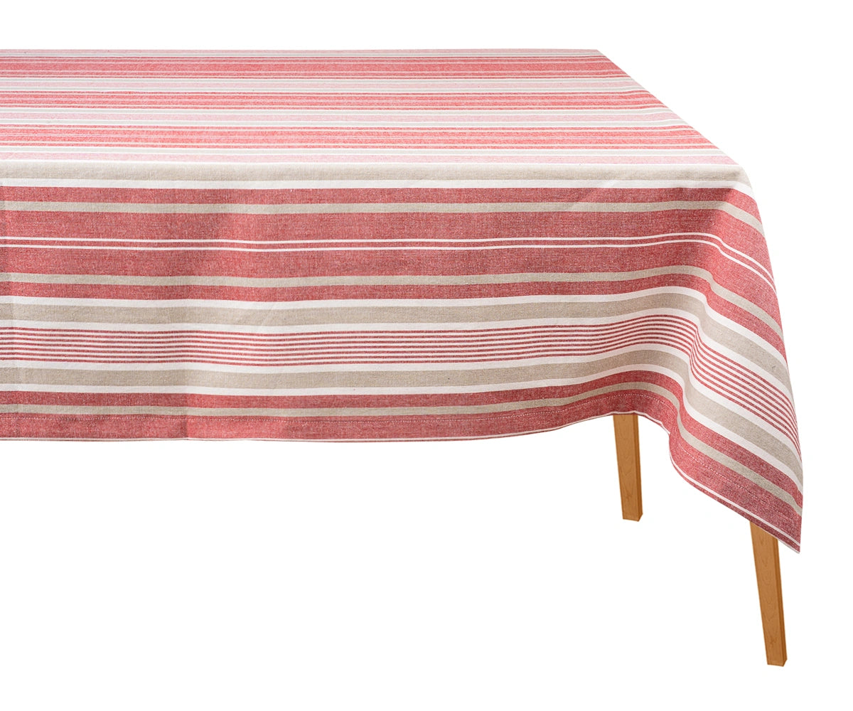 Red striped cotton tablecloth draped over a wooden dining table against a plain white background.