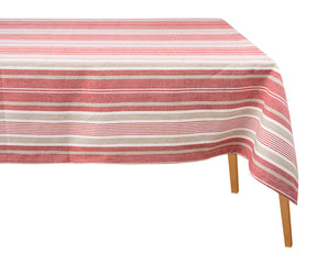 Red striped cotton tablecloth draped over a wooden dining table against a plain white background.