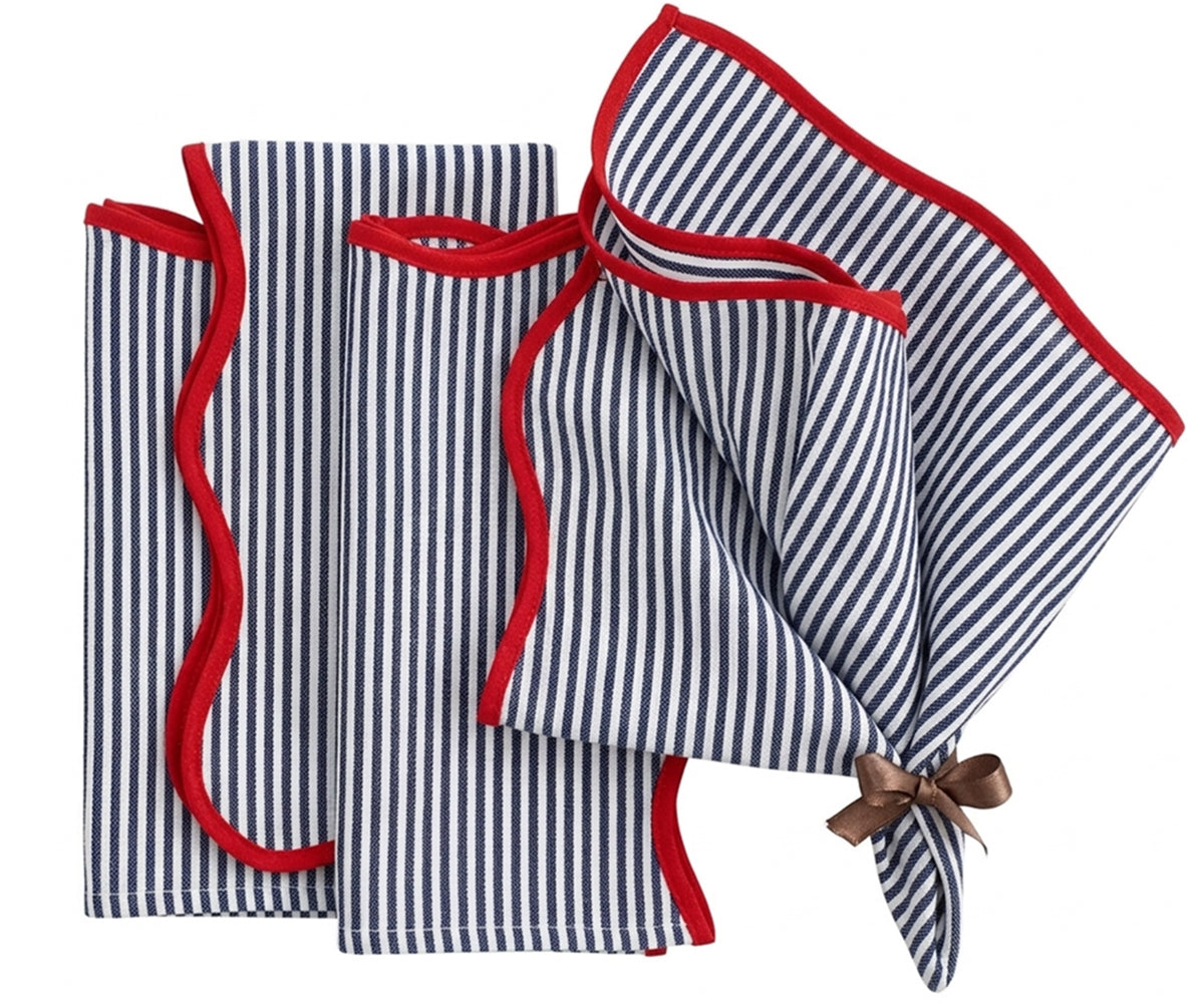 Blue and white striped cotton napkins with red edge detail, reusable washable dinner napkins styled on a dining table with coordinating striped tablecloth.