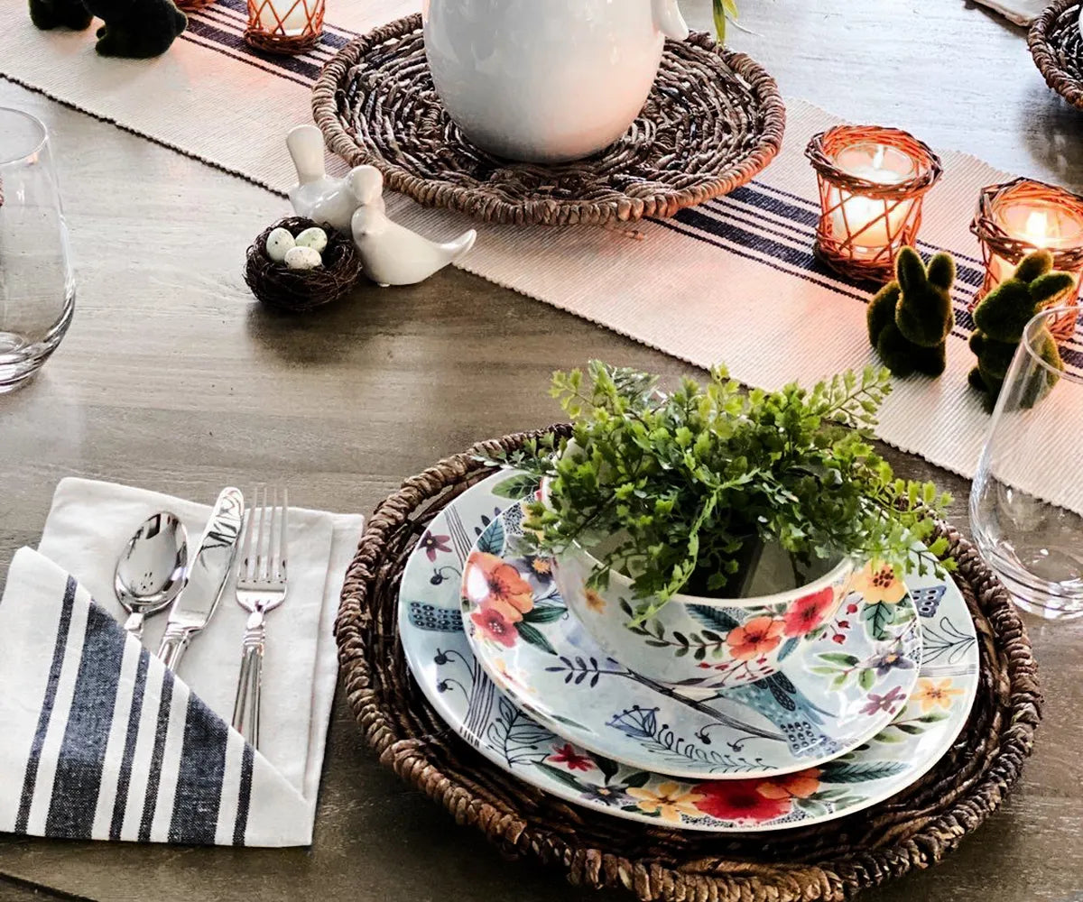 Elegant black and white striped dinner napkins paired with matching striped tablecloth for coordinated table décor