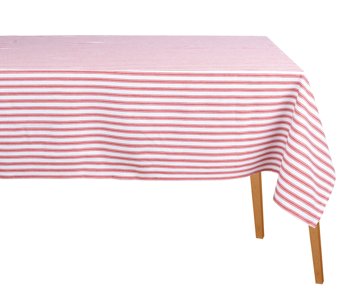 Farmhouse-style dining setup with red striped rectangular tablecloth