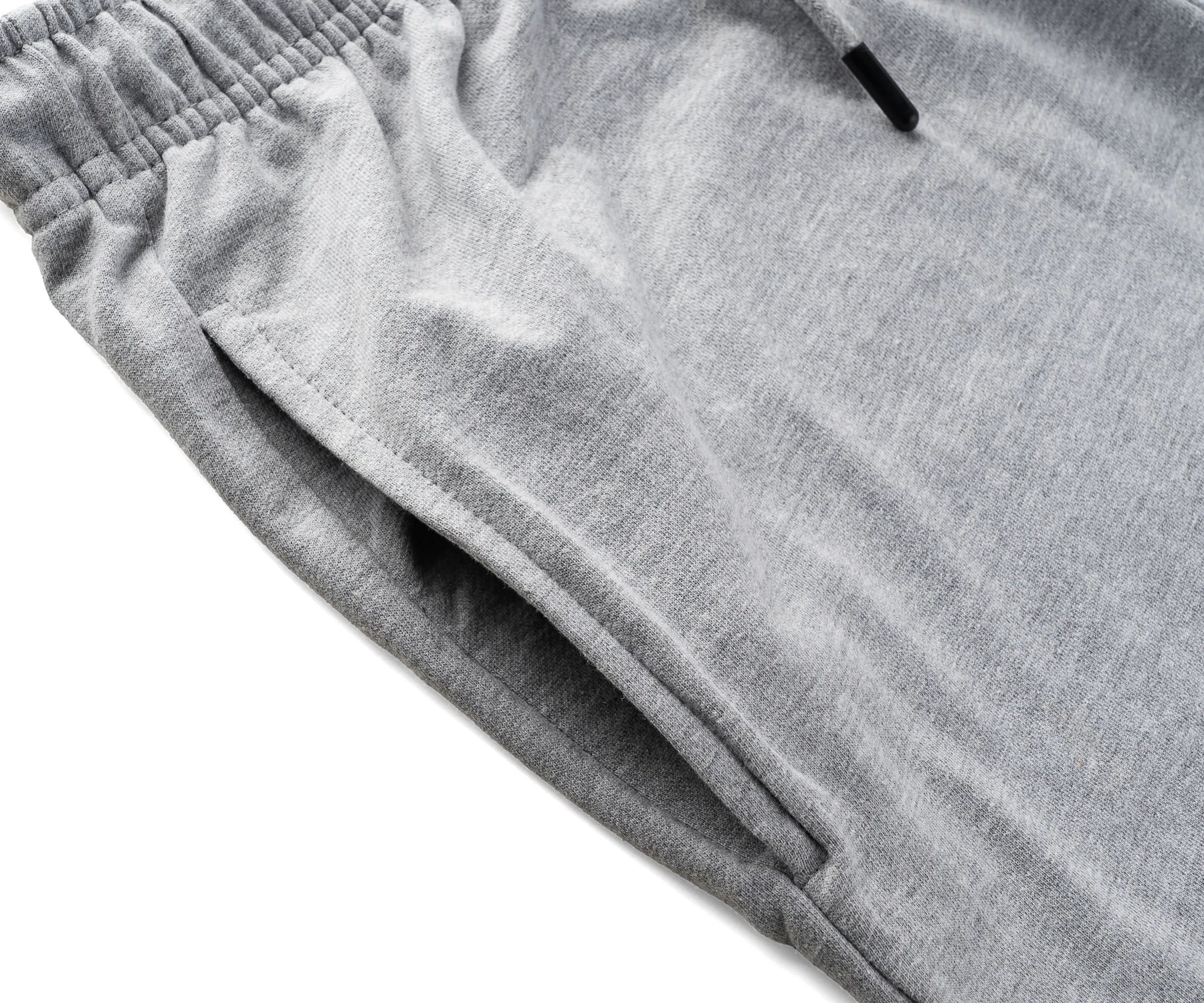  Comfortable grey shorts styled with a white t-shirt, ideal for casual men’s summer outfits