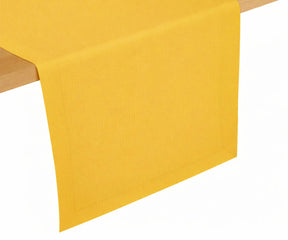 Mustard yellow cotton table runner styled on dining table, vibrant modern color for cheerful table décor