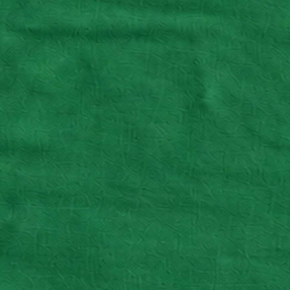 Green linen tree skirt creating a coordinated holiday look around the base of a Christmas tree