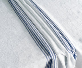 White linen tablecloth on a table set for a meal