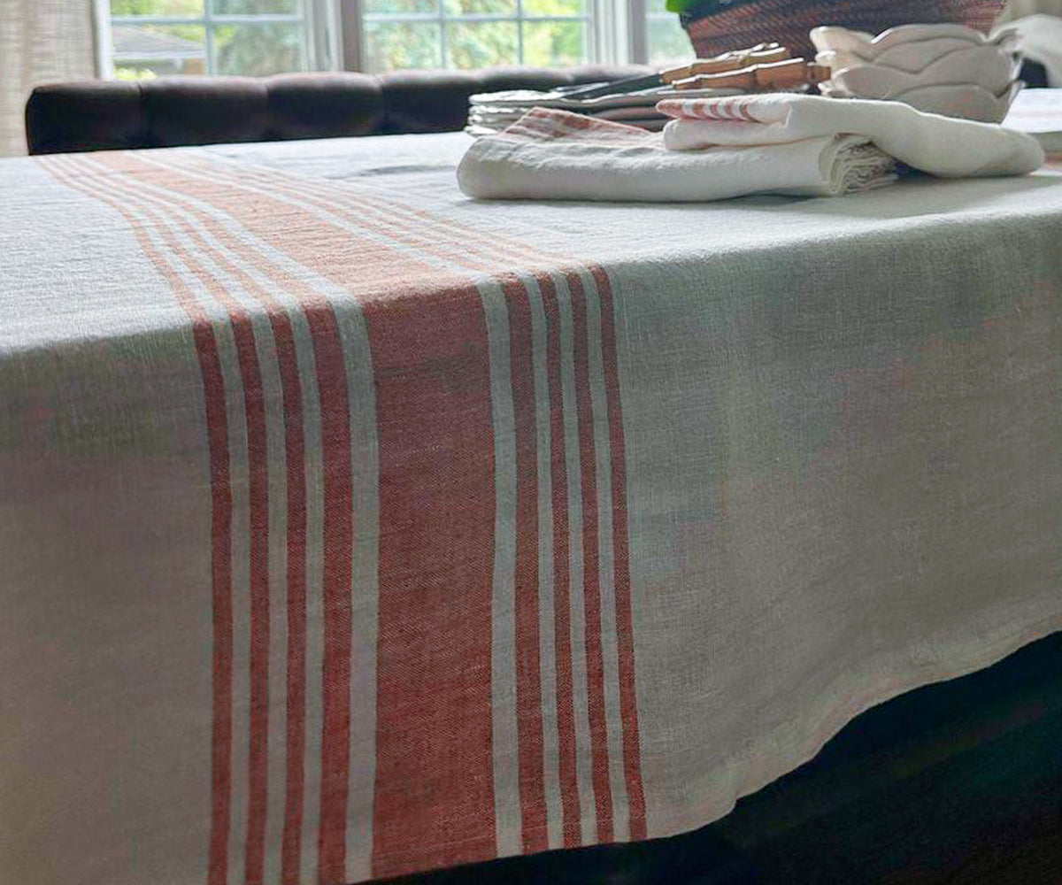White linen tablecloth with bold red stripe embellishments