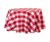 A round tablecloth with a buffalo plaid pattern in black and white, displayed on a table.