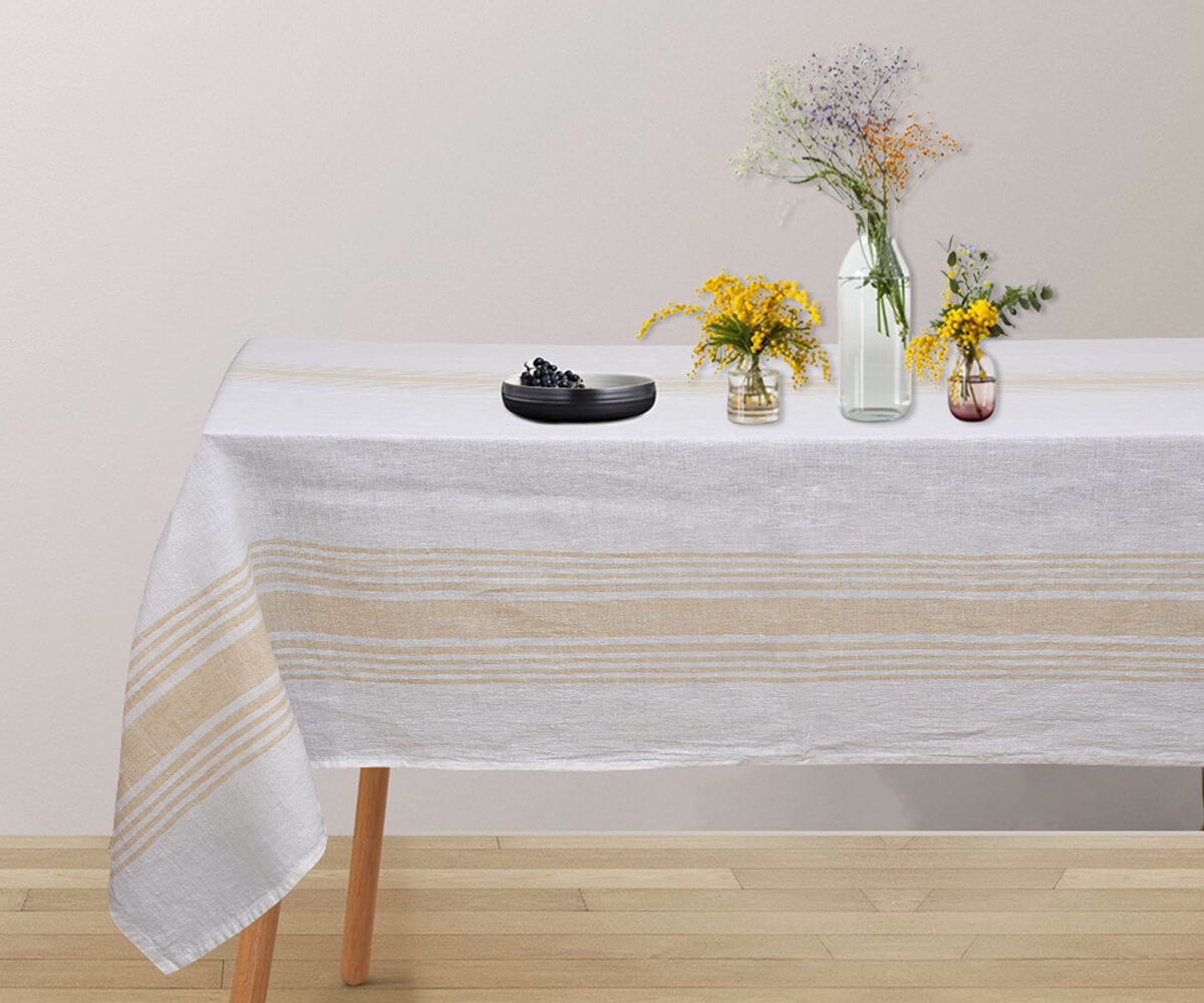 A clean and crisp white tablecloth in a rectangular shape.