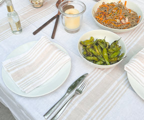 Simple yet refined white linen tablecloth covering a table