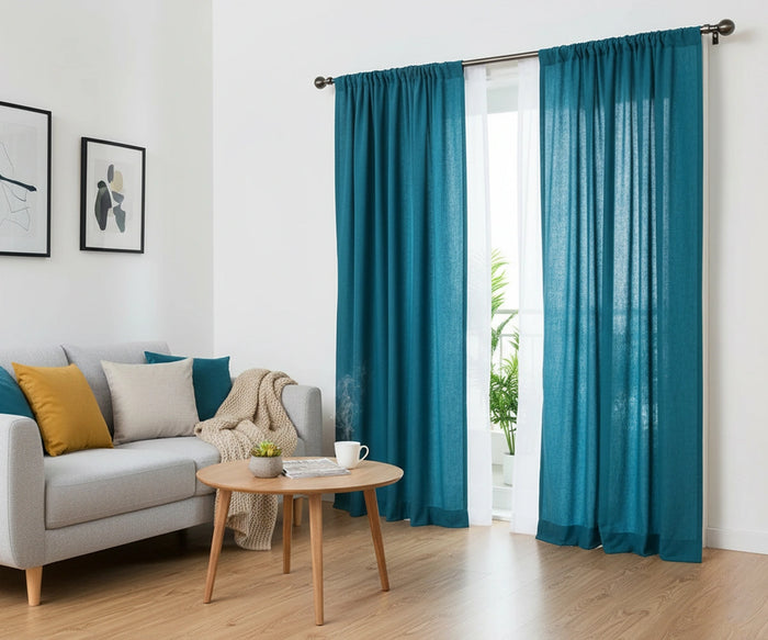 Teal curtains hanging in a bright living room with elegant teal drapes curtains and modern window decor