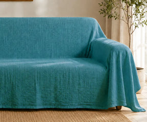 Natural linen couch sheet cover with a soft finish for modern living room furniture protection.