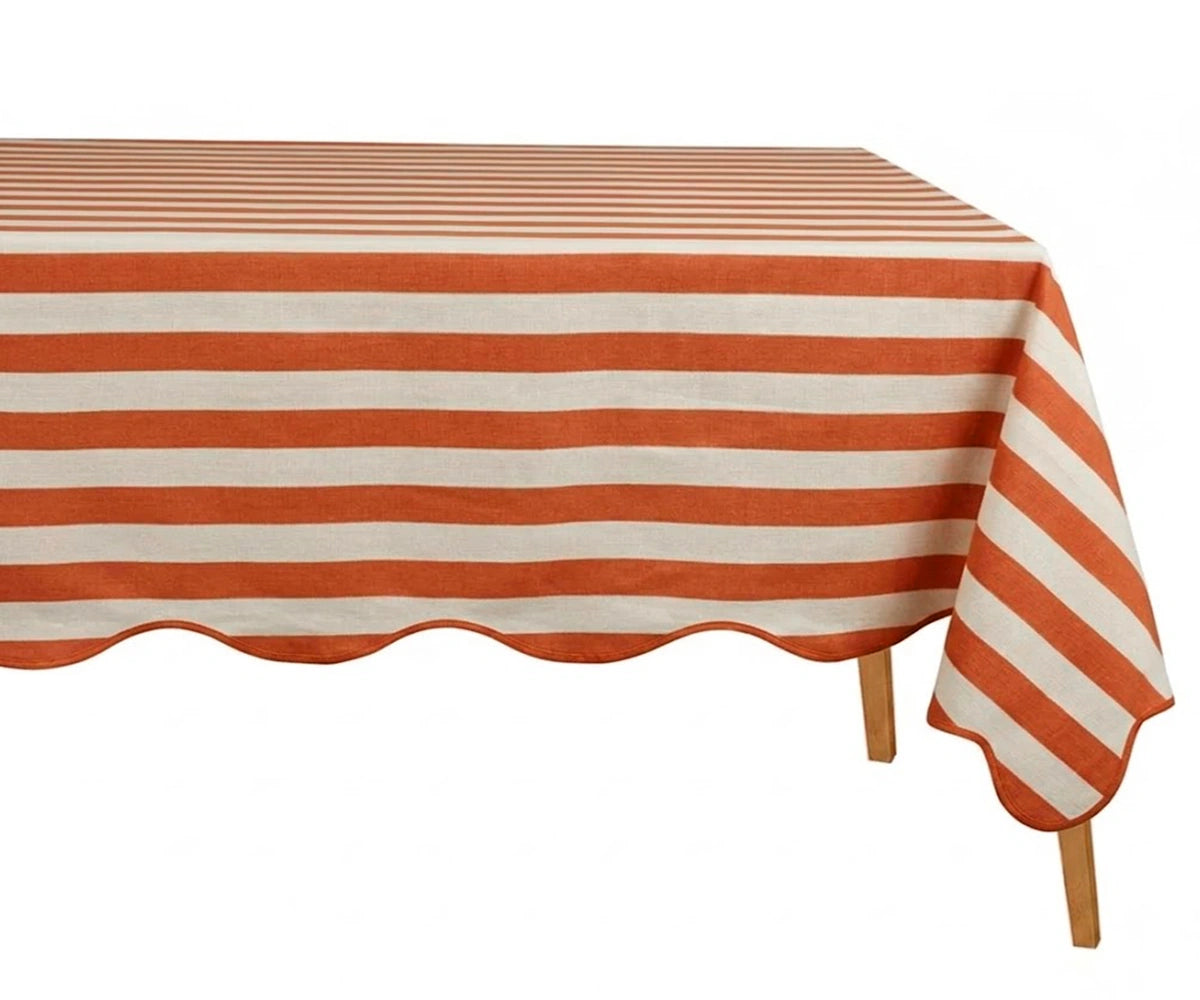Terracotta and white striped tablecloth on rectangular table
