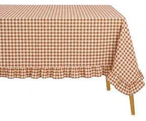 Soft woven cotton gingham tablecloth adding rustic charm to modern and cottage style dining spaces