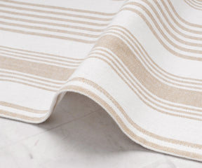 Close-up of beige striped cotton cloth napkin