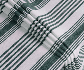Green and white striped rectangular tablecloth with soft drape on dining table
