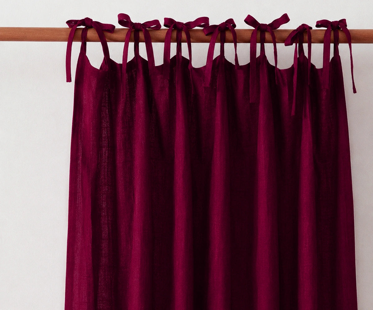 Burgundy tie top linen drapes made from premium flax linen, rustic window curtains for dining rooms, cozy bedrooms, and traditional interiors.