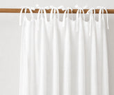 White natural linen tie top curtains, airy light filtering window panels for Scandinavian, coastal, and minimalist home interiors.
