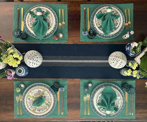 Upgrade your table decor with green fabric placemats, adding a touch of charm and protection, perfect for enjoyable dining moments.