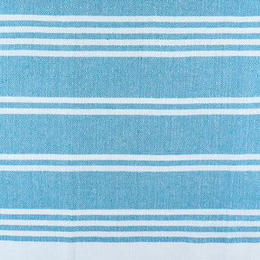 Elegant aqua cotton beach towels rolled and ready for travel or gifting