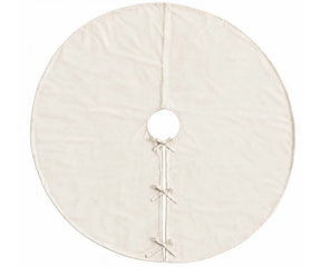 Plain ivory linen tree skirt placed around the base of a Christmas tree for a neutral look