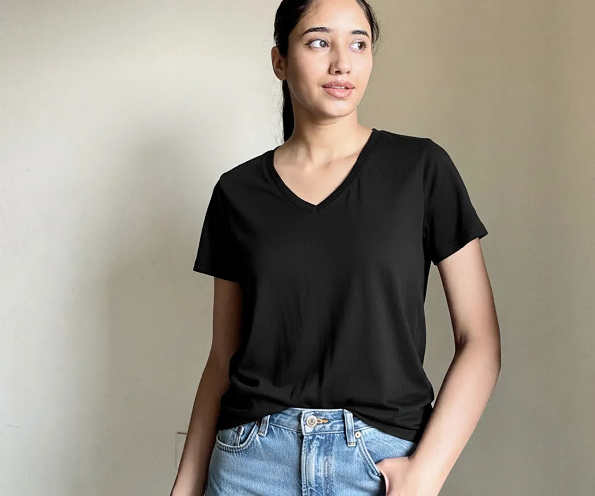 Women’s deep V-neck black t-shirt made from 100% organic cotton – breathable, soft, and versatile everyday essential.