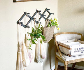 Reusable mesh produce bag placed on a chair with decorative flowers
