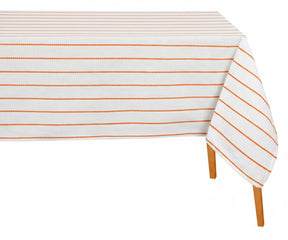 Orange striped rectangular tablecloth styled on a dining table with neutral decor for everyday dining and casual entertaining