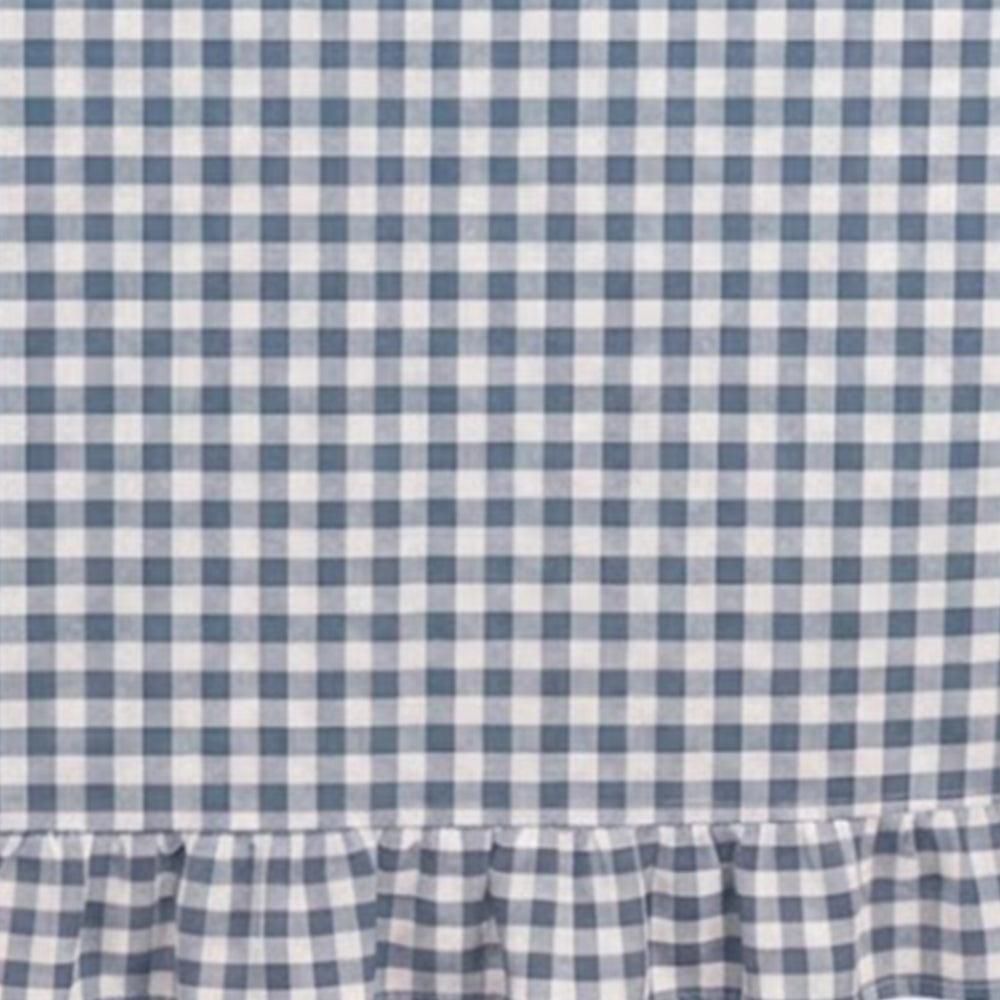 Macro shot of cotton gingham fabric emphasizing durability and natural fiber texture