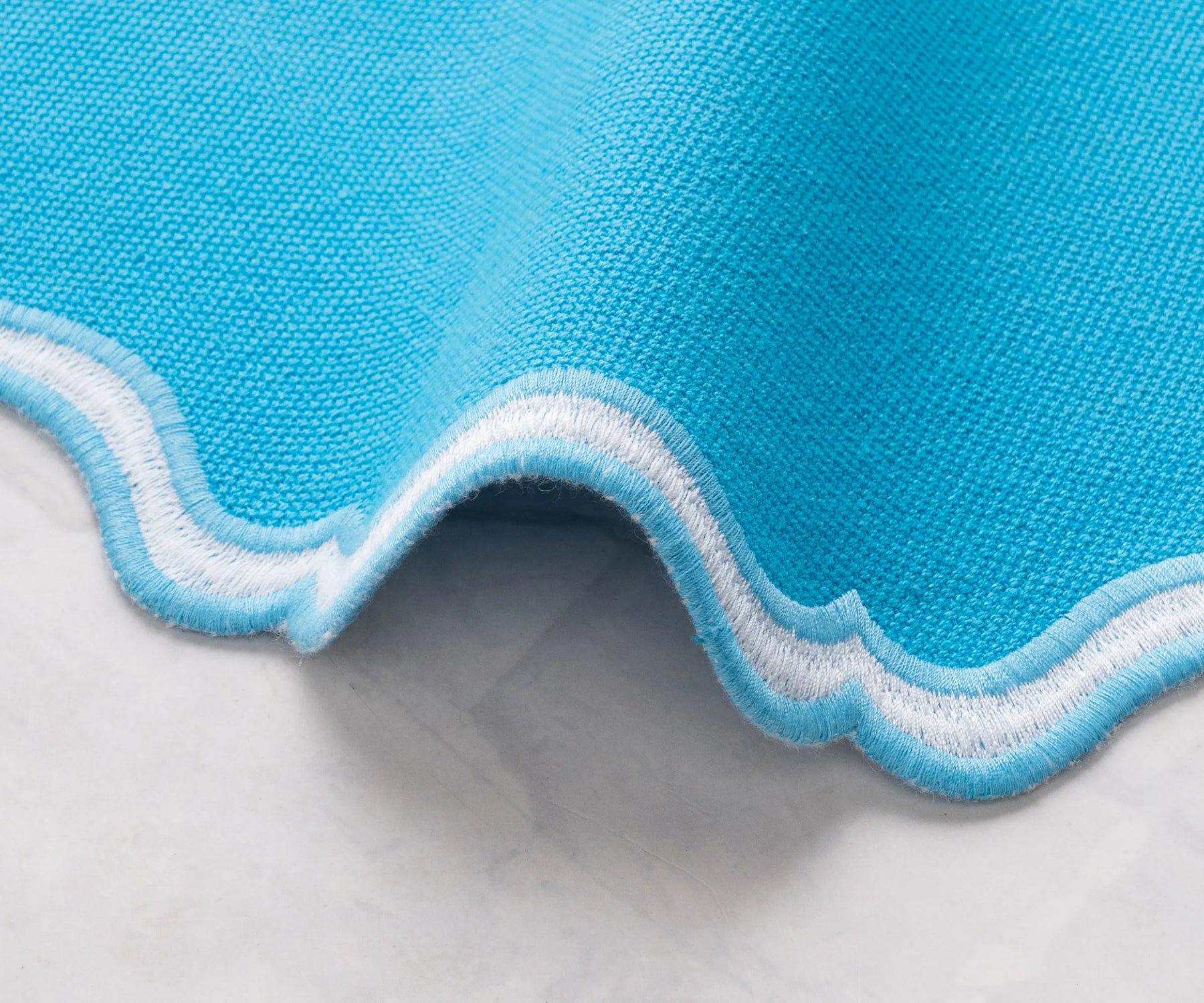 Round turquoise scalloped placemat, perfect for weddings, parties, and everyday dining
