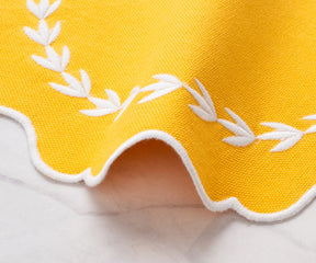 Durable round placemat in yellow, washable and reusable for family meals
