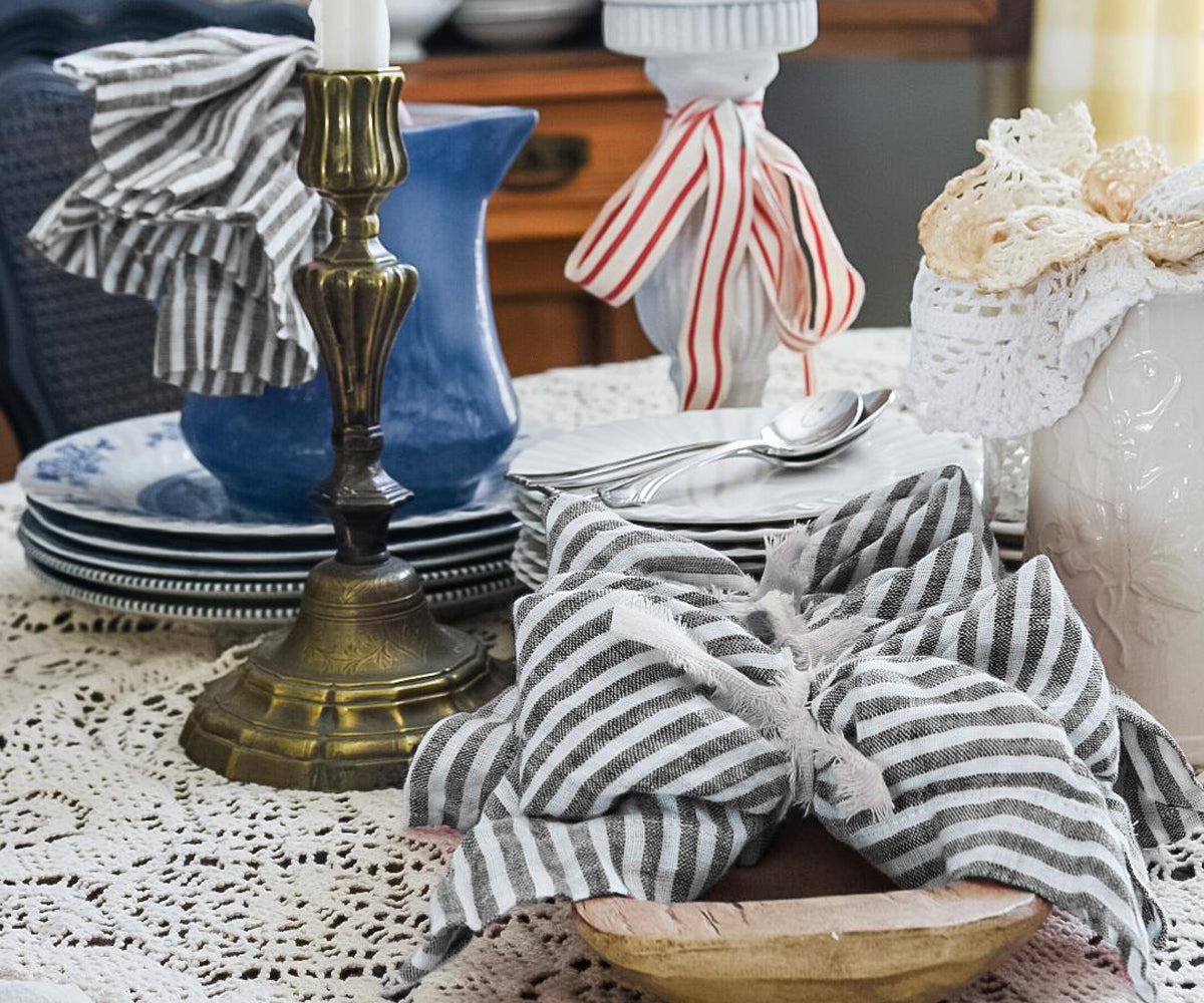 Elegant black striped cloth napkins arranged for wedding receptions and special event tablescapes