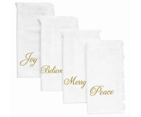 White cotton fringe napkins with gold embroidered Joy, Believe, Merry & Peace – perfect for Christmas and holiday tables