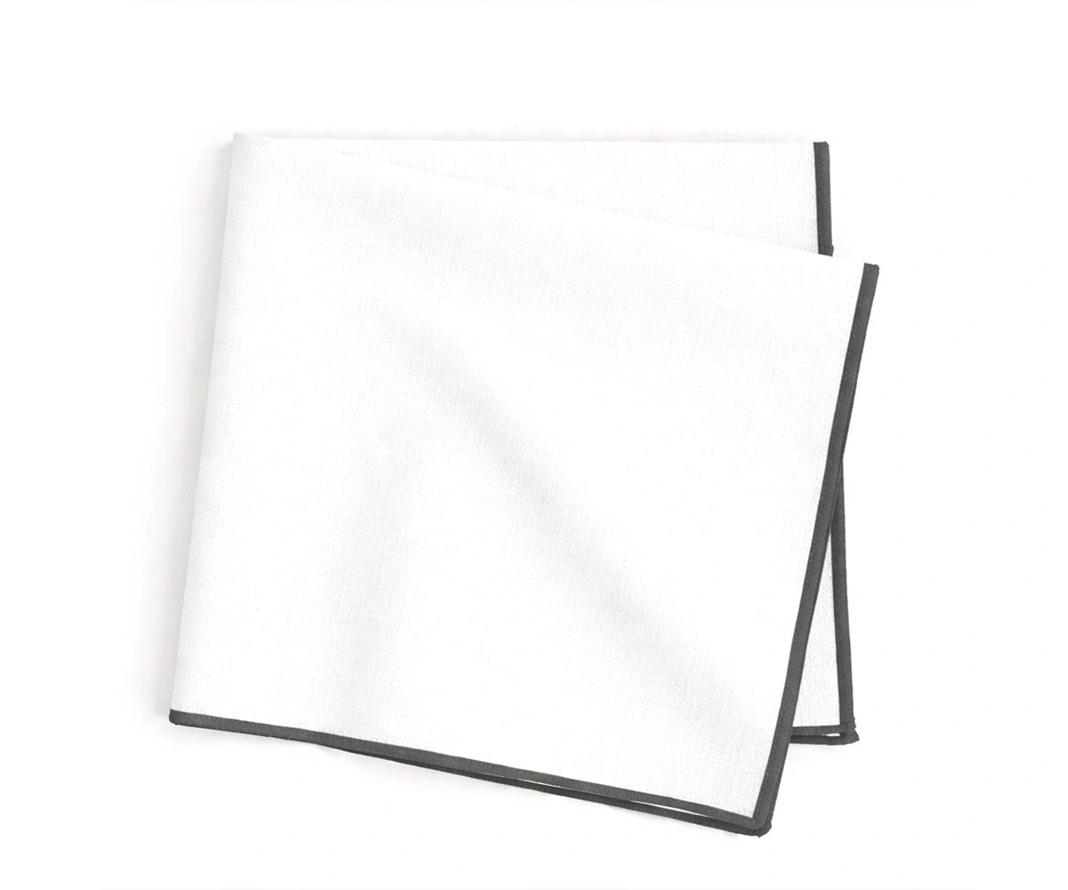 embroidered cotton napkins detailed with charcoal merrow stitching for sleek and elegant dining