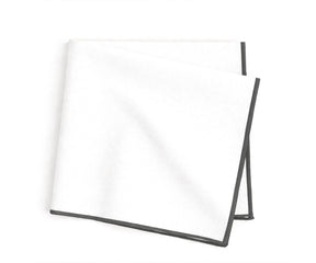 embroidered cotton napkins detailed with charcoal merrow stitching for sleek and elegant dining