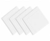 White hemstitched cotton linen blend dinner napkins arranged on an elegant dining table with classic dinnerware and neutral tablecloth