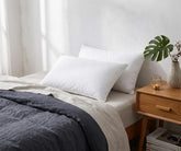 White cotton pillowcases on a modern bed with soft breathable cotton bedding and luxury pillowcases for stylish bedroom decor