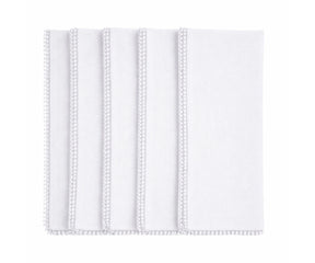 White cotton pom pom napkins with knotted edge for classic, wedding, and minimalist tables