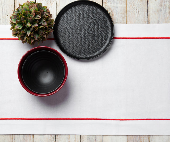 Farmhouse-style table runner with subtle embroidery.