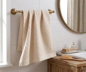 white cotton waffle bath towel hanging on towel rack in modern bathroom quick dry absorbent towel