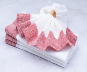 Dinner napkins made of cloth are available in various colors, including white and red. Consider using cloth dinner napkins to elevate your dining experience.