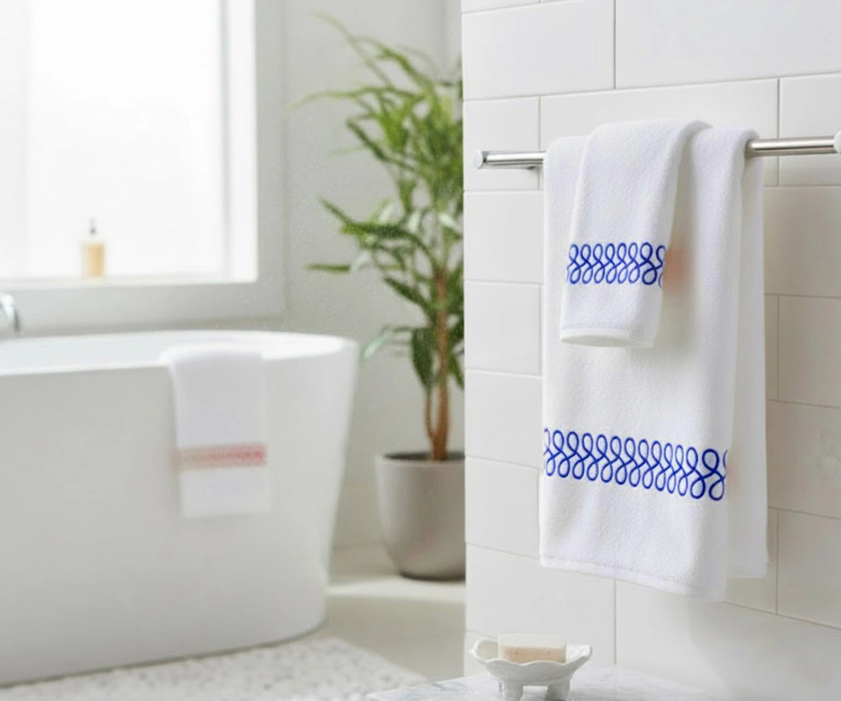 White embroidered bath towels with blue border set, soft cotton luxury bath towels, absorbent and stylish bathroom towels for modern home