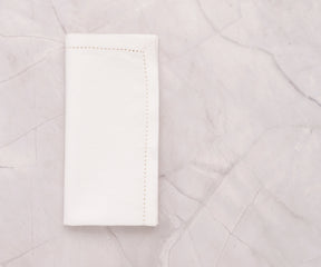 White hemstitched cotton-linen dinner napkins