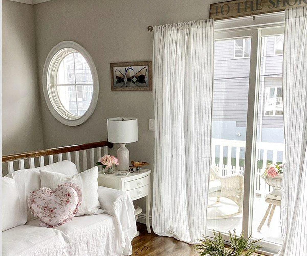 White 100% linen curtains with subtle stripe detail, styled in a bright living room