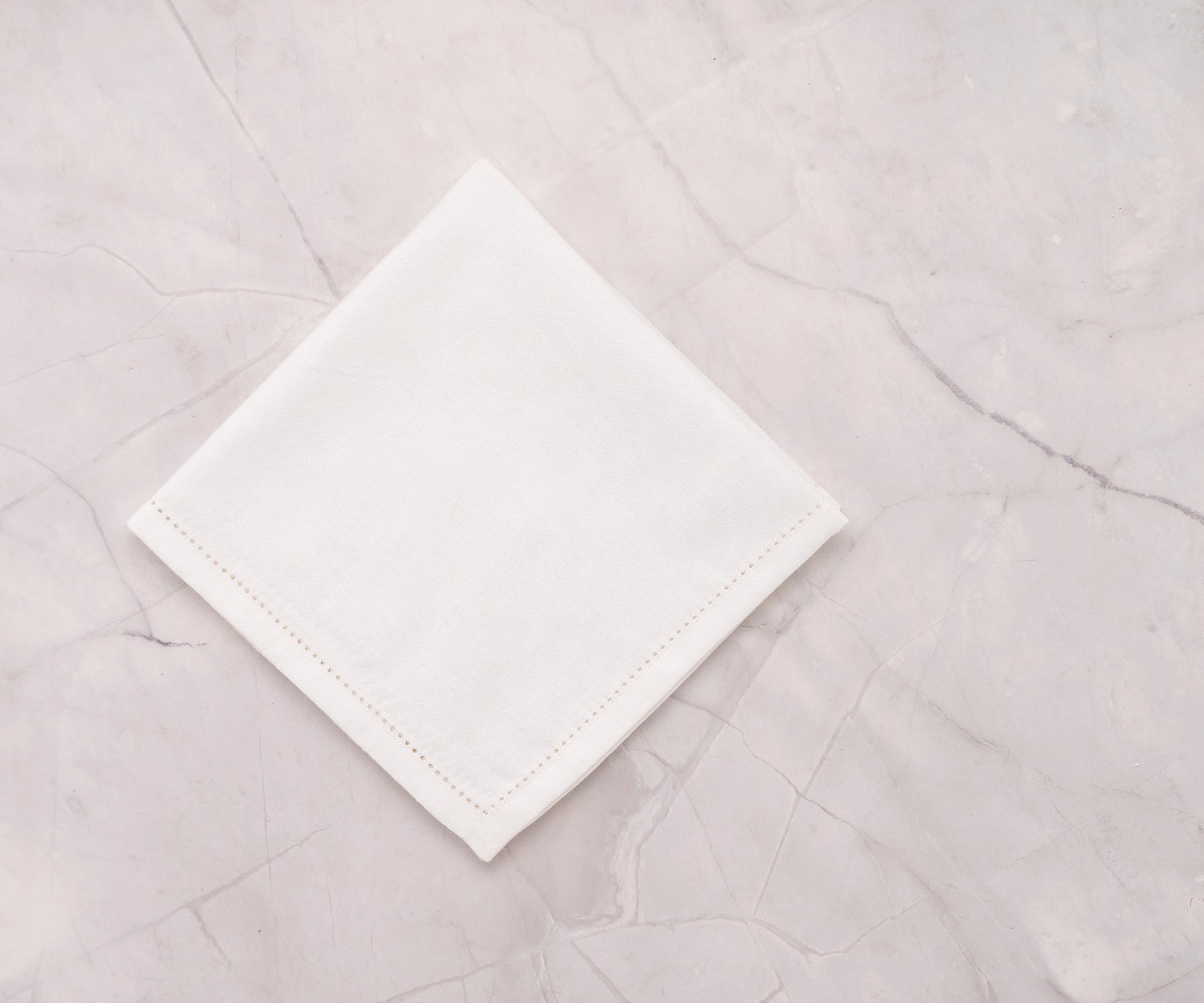 hemstitch border on white cotton-linen napkin