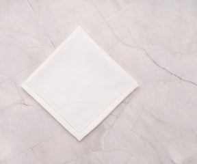 hemstitch border on white cotton-linen napkin