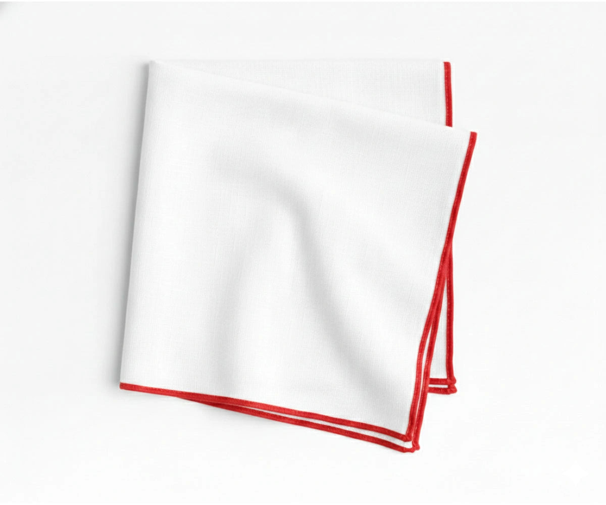 Classic white embroidered cotton napkins accented with bold red merrow stitching for elegant entertaining