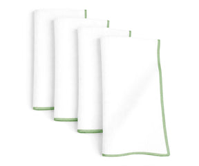 White base cotton napkins finished with sage green merrow stitching for calm and earthy dining décor