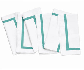 Soft and absorbent white dinner napkin with decorative trim, combining practical everyday use with timeless style.